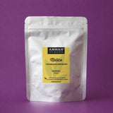 Envase Doypack plateado con etiqueta amarilla de Matico Amman Tea Blends, con propiedades cicatrizantes y depurativas, sobre fondo morado.