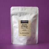 Envase Doypack plateado de Semillas de Hinojo Amman Tea Blends con propiedades carminativas y diuréticas, sobre fondo morado.