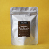 Envase Doypack plateado de Té Negro y Cascarilla de Cacao Amman Tea Blends, reponedor de energía, sobre fondo amarillo.